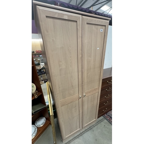 844 - A beech effect wardrobe