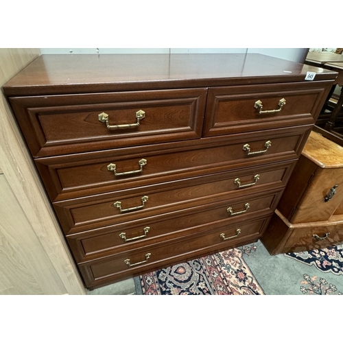 845 - A dark wood chest of drawers