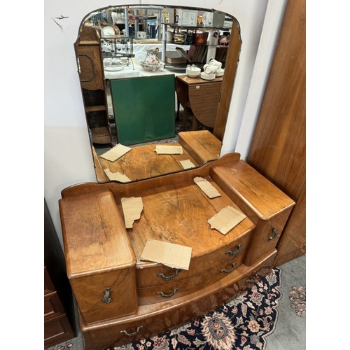 850 - A 1930's walnut veneered bedroom suite comprising of 2 wardrobes and a dressing table