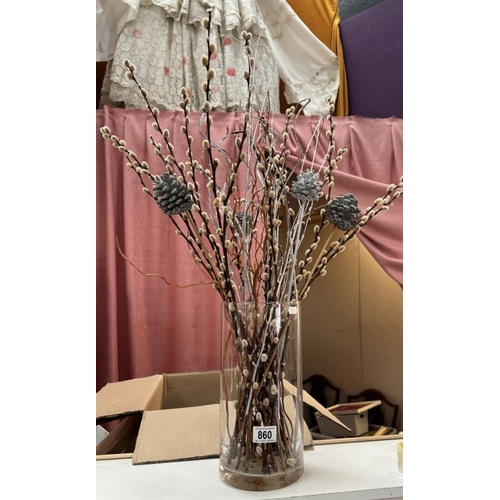 860 - A tall straight sided glass vase with natural & artificial floral stems