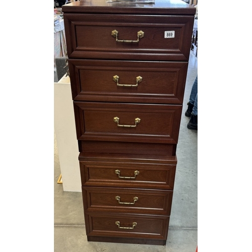 869 - A pair of dark wood bedroom bedside chest of drawers