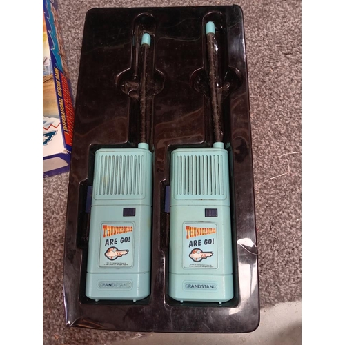 882 - A vintage Thunderbirds walkie talkie & a Thunderbird game (completeness unknown)