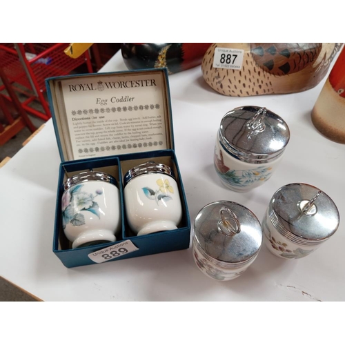 889 - A boxed set of 2 egg coddlers & 3 other egg coddlers