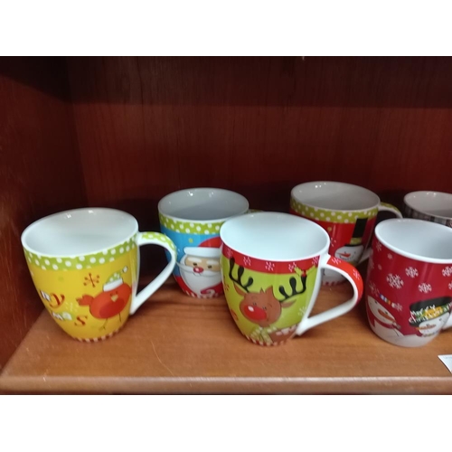 917 - A quantity of Christmas mugs