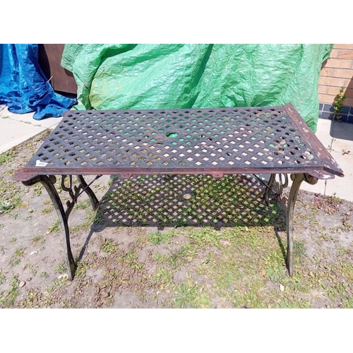 950 - A cast iron garden table