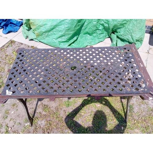 950 - A cast iron garden table