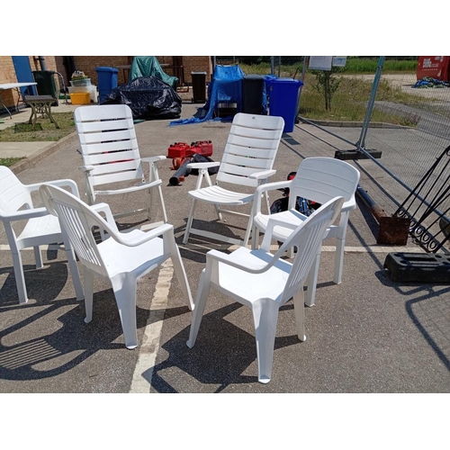 957 - A selection of white plastic garden chairs