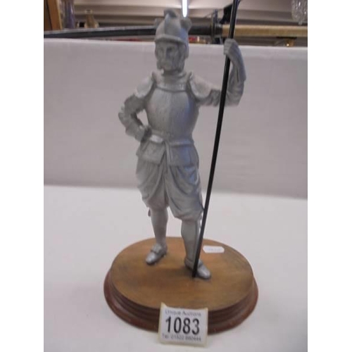 1083 - A metal figure of a knight (possibly Don Quixote).