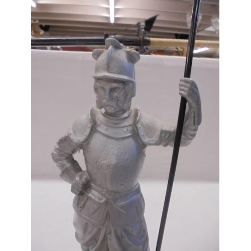 1083 - A metal figure of a knight (possibly Don Quixote).