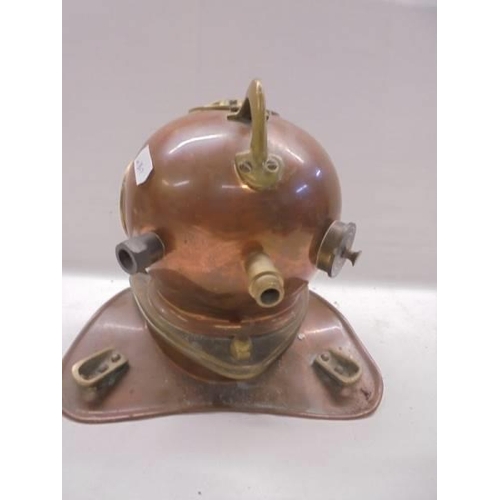 1086 - A brass and copper model of a divers helmet.