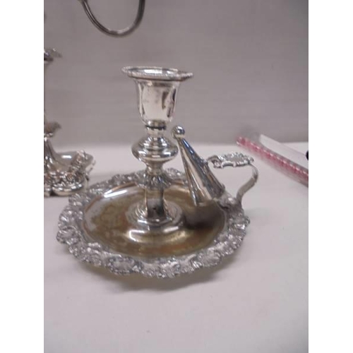 1088 - An ornate silver plate candelabra, a chamber candlestick and a wine funnel.