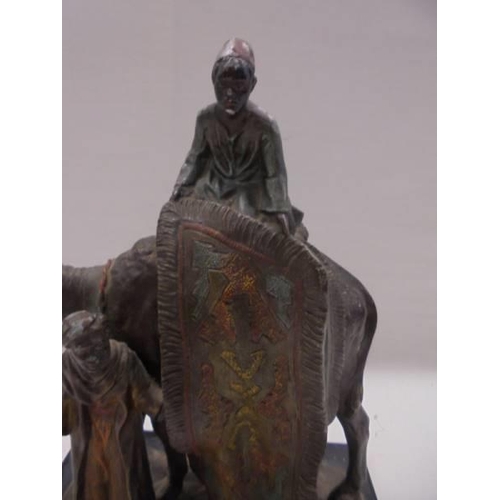 1090 - An Austrian cold painted spelter carpet seller seater on a camel.