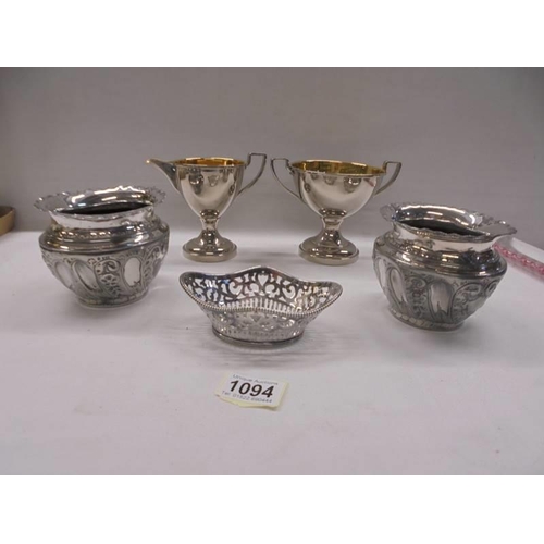 1094 - A silver plate jug, sugar bowl, sweetmeat dish and two planters.