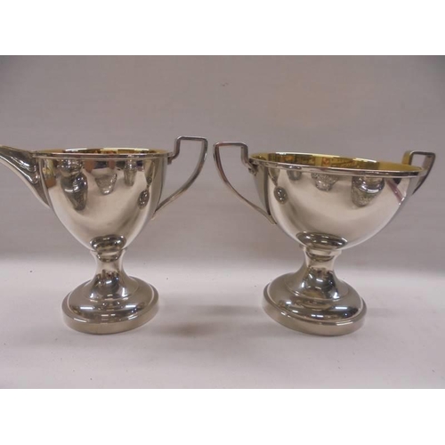 1094 - A silver plate jug, sugar bowl, sweetmeat dish and two planters.