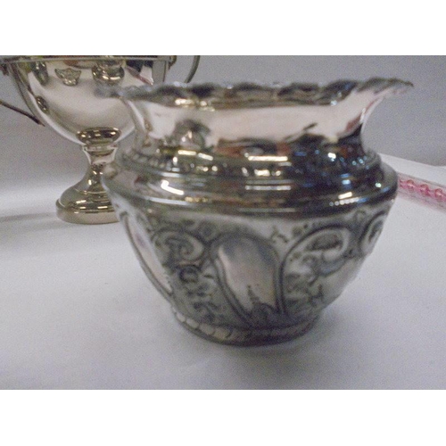 1094 - A silver plate jug, sugar bowl, sweetmeat dish and two planters.