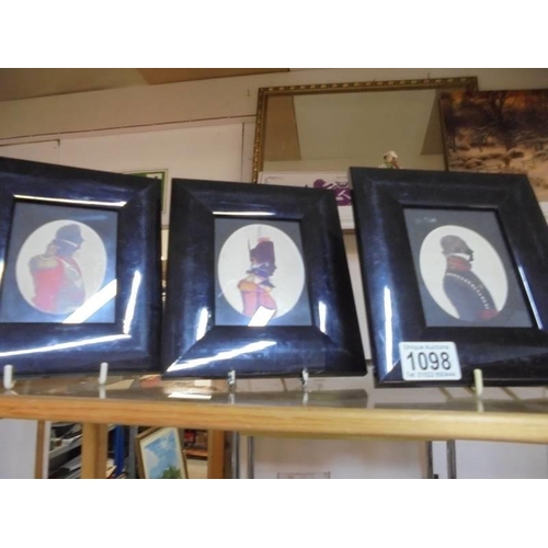 1098 - Three framed and glazed military coloured silhouettes.