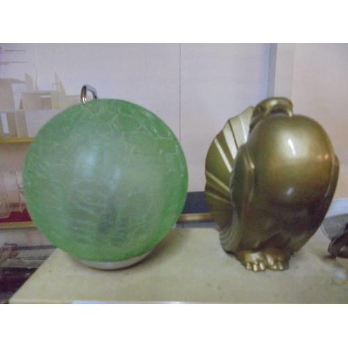 1099 - An art deco lamp on a marble base with a dove and a green globe shade.