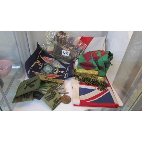 A quantity of cloth badges, a Royal Marines New Zealand pennant ...