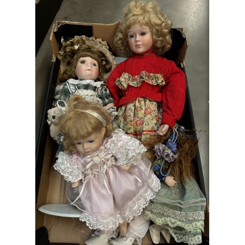 101 - A box of porcelain dolls