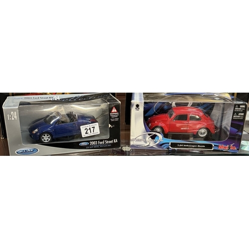 217 - 3 Boxed Burago 1/18 scale cars including Jaguar e-type, A Maistro Volkswagen beetle & Ford Street KA