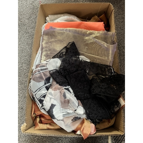 251 - A quantity of silver metallic fabric with similar fabric, A quantity of gold & orange fabric & other... 