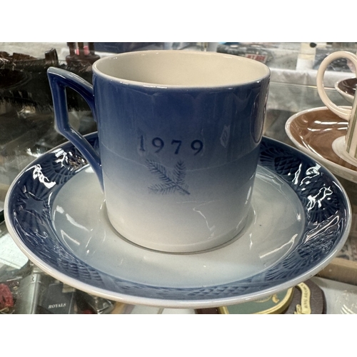 283 - A Susie Cooper pin stripe coffee can set and a Royal Copenhagen cup and saucer