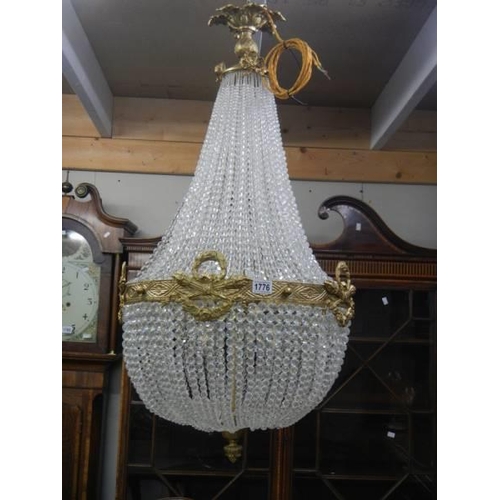 1776 - A mid 20th century brass and glass 'basket' chandelier, COLLECT ONLY.