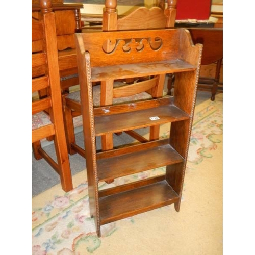 1789 - A mid 20th century oak four shelf book case. COLLECT ONLY.