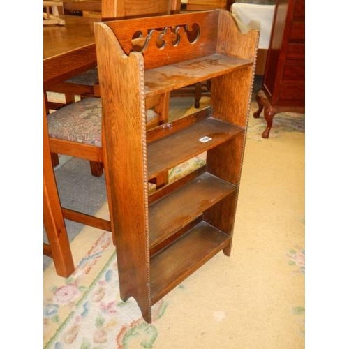 1789 - A mid 20th century oak four shelf book case. COLLECT ONLY.