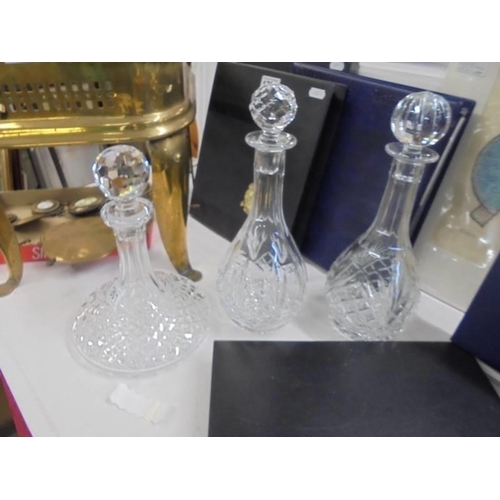 1801 - A pair of cut glass decanters and a cut glass ships decanter.