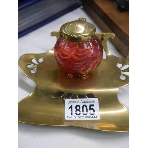 1805 - A brass inkstand with red glass inkwell.