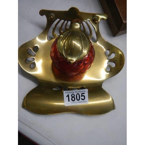 1805 - A brass inkstand with red glass inkwell.