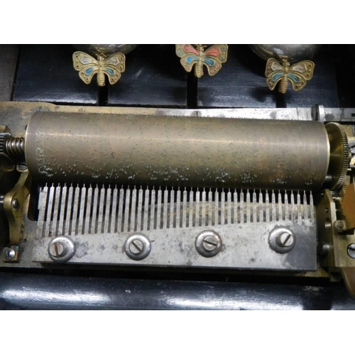 1810 - A Victorian music box on three bells with butterflies, in working order.