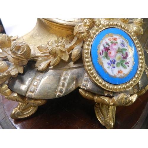 1814 - A French gilded mantel clock surmounted cherub figure and with Sevres porcelain panels, COLLECT ONLY... 