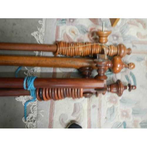 1819 - A quantity of wooden curtain poles with rings, COLLECT ONLY.