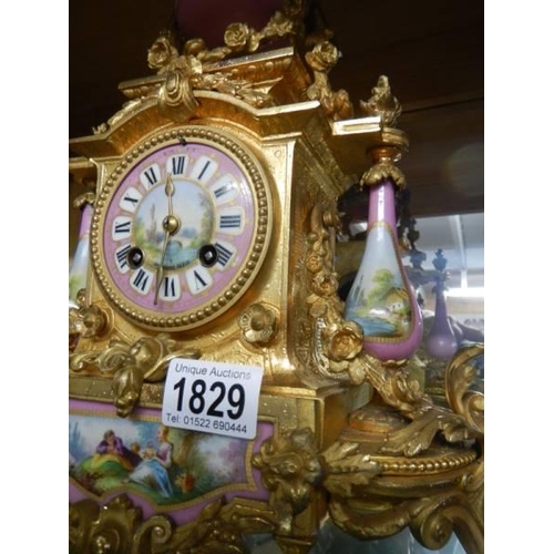 1829 - A French gilded mantel clock with Sevres panels, in working order, COLLECT ONLY.