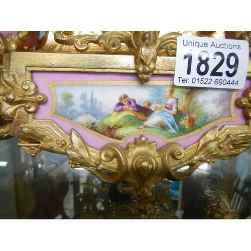 1829 - A French gilded mantel clock with Sevres panels, in working order, COLLECT ONLY.