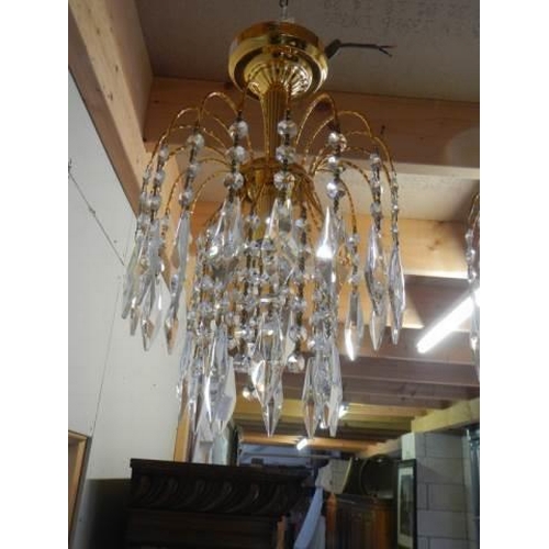 1838 - A set of four matching glass chandeliers.