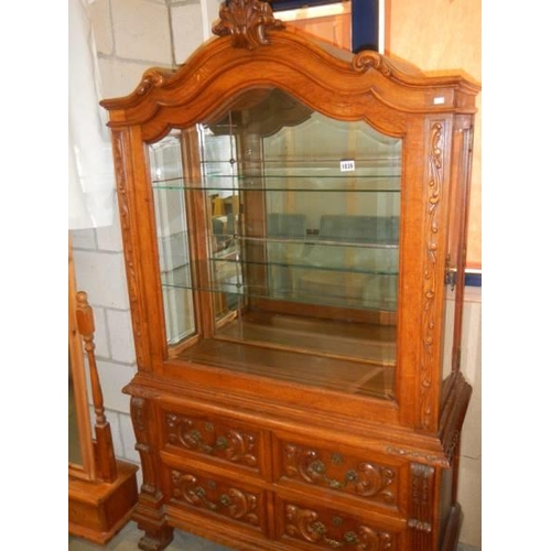 1839 - A glazed display cabinet on carved drawer base. COLLECT ONLY.