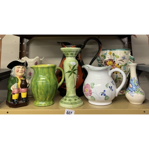 607 - A shelf of pottery jugs, vases etc including Toby jug etc