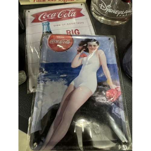 660 - A good selection of Coca Cola branded items including bottle opener, bottles (2 sealed) tin, glasses... 