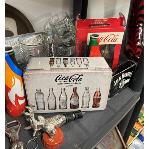 660 - A good selection of Coca Cola branded items including bottle opener, bottles (2 sealed) tin, glasses... 