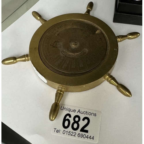 682 - A brass 30 year calendar ships wheel paperweight 2000 - 2030