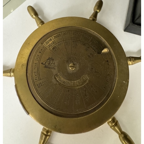 682 - A brass 30 year calendar ships wheel paperweight 2000 - 2030