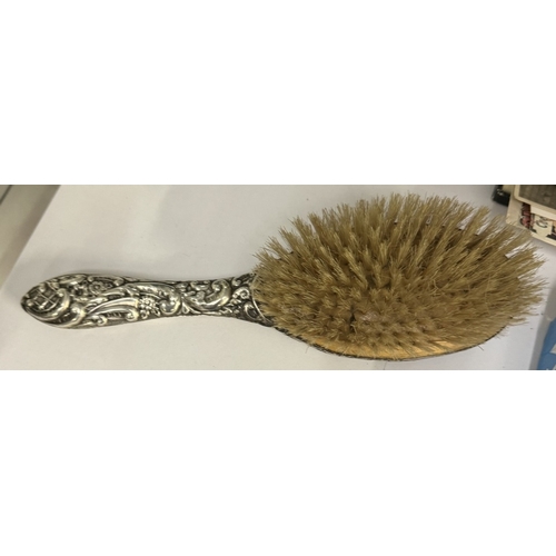 689 - A Victorian Chester silver mounted hair brush