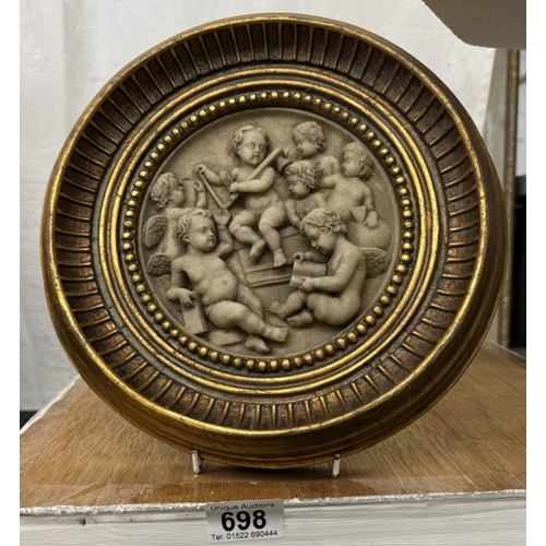 698 - A gilt framed plaque depicting cherubs