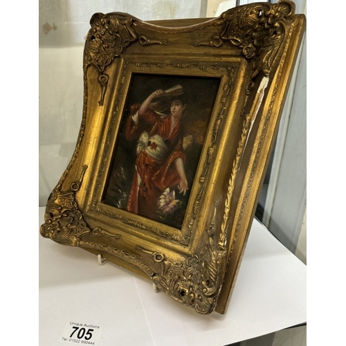 705 - A gilt framed enhanced print of a lady