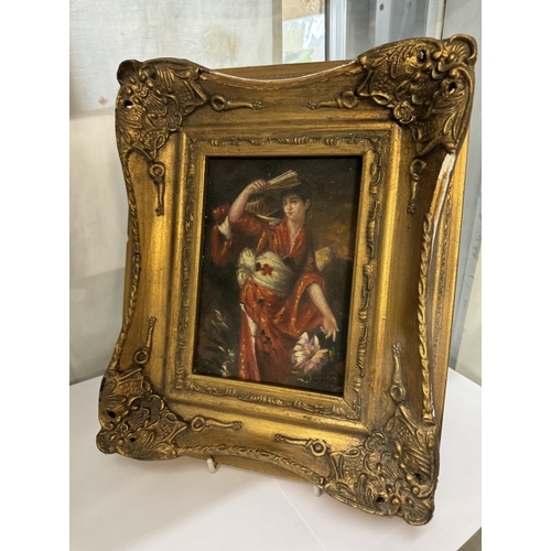 705 - A gilt framed enhanced print of a lady