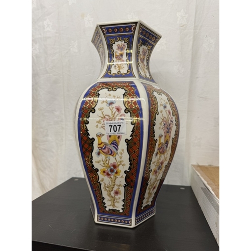 707 - A large gilded and coloured vase