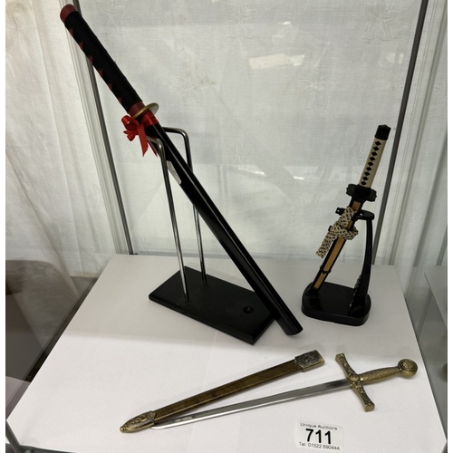 711 - 3 Small ornamental sword letter openers